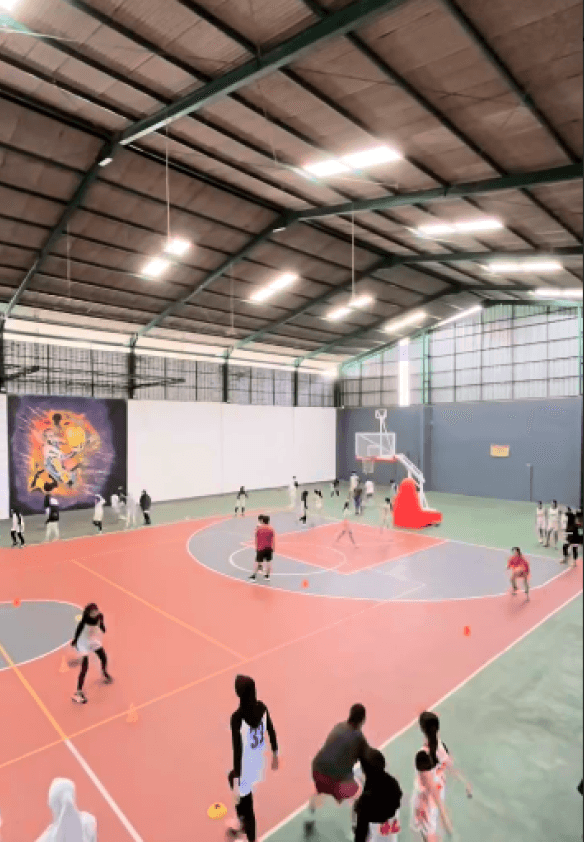 Junior program athletes shooting hoops during training